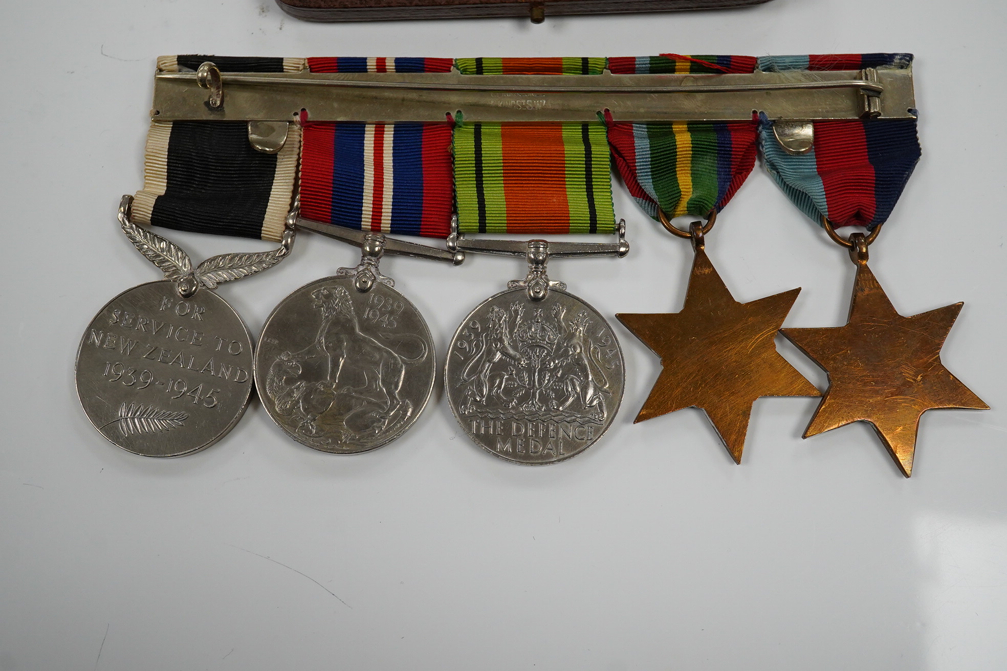 A New Zealand medal group, group of five medals including; The Service to New Zealand Medal 1939-1945, the Pacific star, the 1939 to 1945 star, etc. together with the cased miniature group. Condition - good